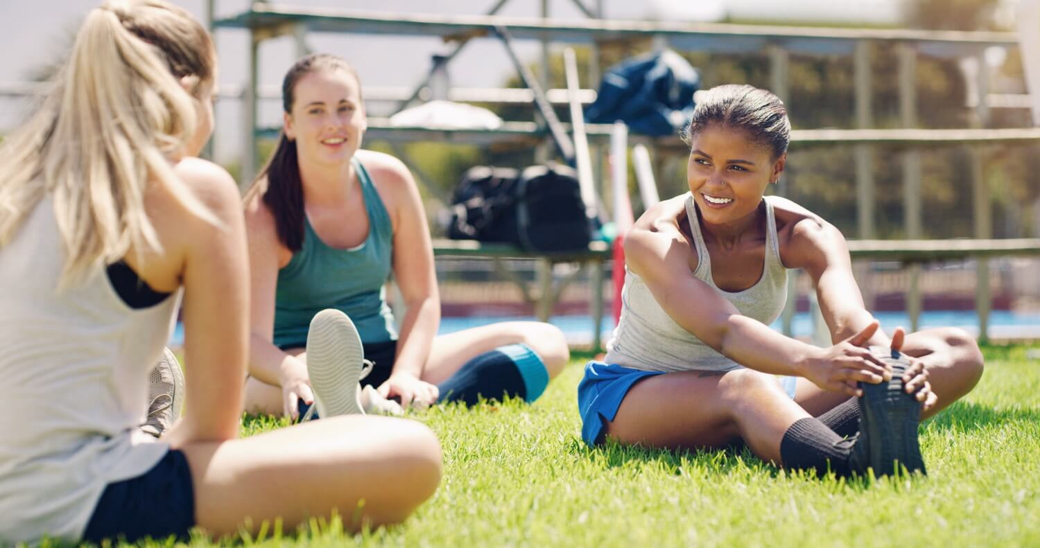 Female participants chatting while stretching