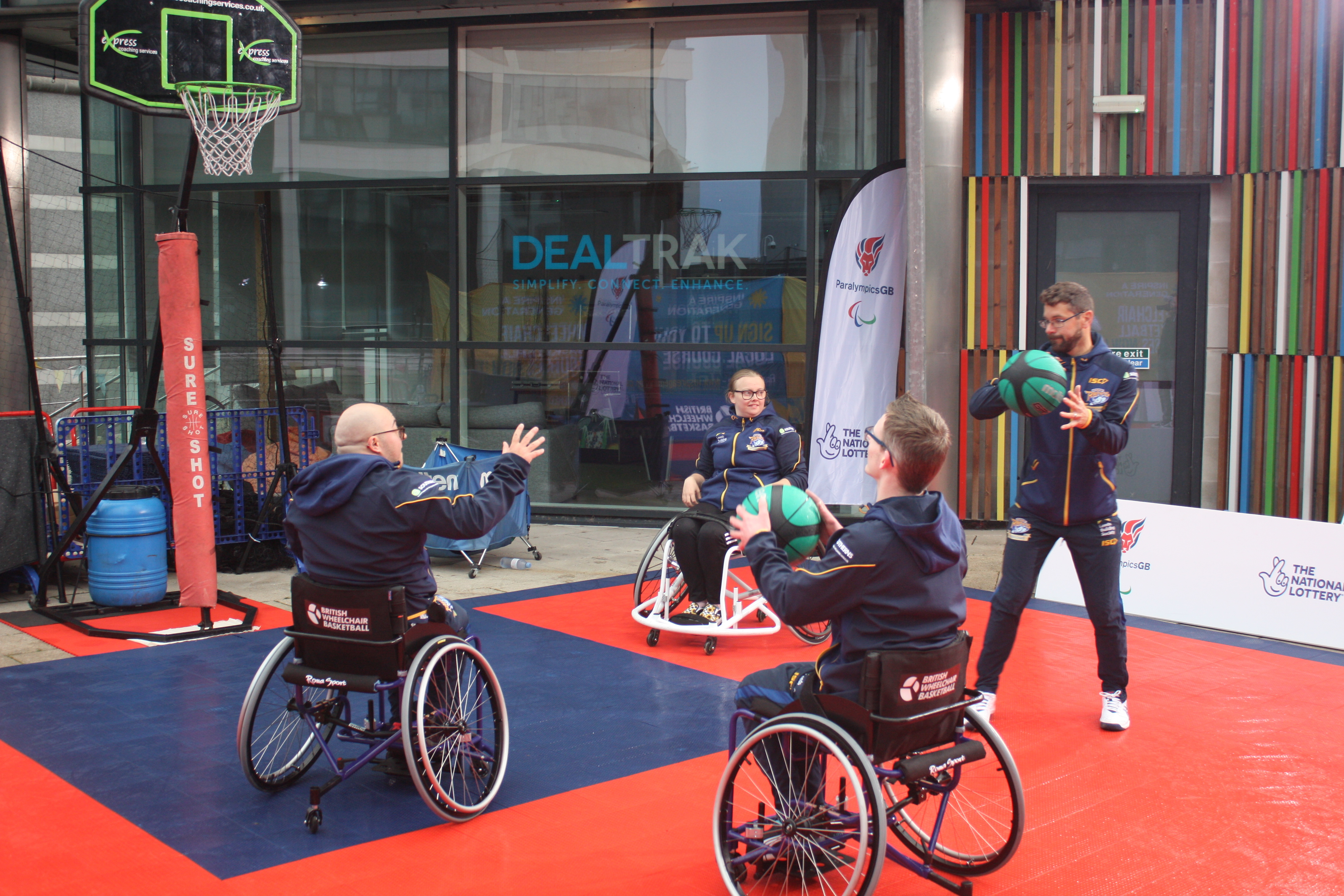 A group of participants playing wheelchair basketball.