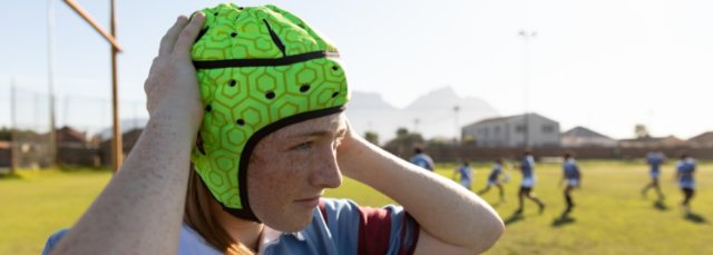 Rugby player wearing protective cap