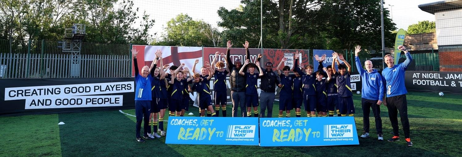 A group of football participants at the Nigel James Elite coaching academy for a Play Their Way event