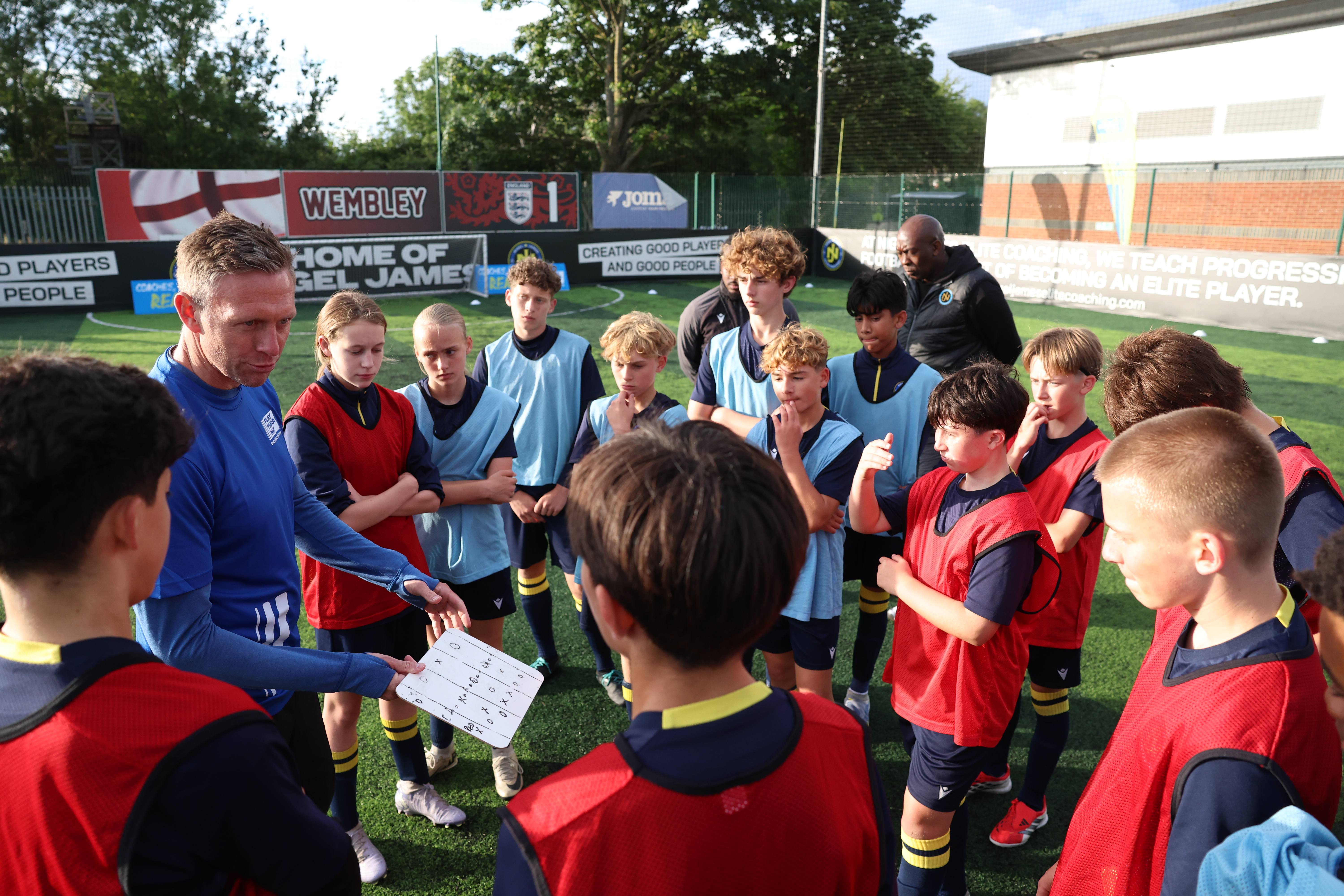Children are instructed by their coach at the Nigel James Elite Coaching football academy